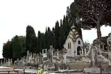 Headstones in Grand Jas Cemetery with a view of the von Derwies' chapel