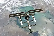 A satellite appears over the earth