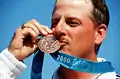 James Graves wearing a bronze medal at the 2000 Summer Olympics, the last version of the Trionfo design