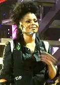 Janet Jackson onstage performing.
