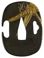 Japanese tsuba with a dragonfly, 1931: Shibuichi with gold and silver, Walters Art Museum