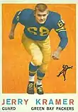 A color photo of a Jerry Kramer running towards the camera, with the text "Jerry Kramer, Guard, Green Bay Packers" in a black bar below the photo