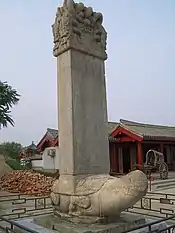 Chinese funeral stone held up by a stone tortoise