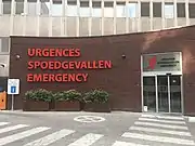 Trilingual signage in French, Dutch and English at an emergency department in Brussels, Belgium