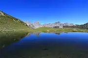 Aiguilles d'Ansabère and Mesa de los Tres Reyes reflected in the lake of Ansabère