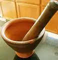 A Lao‑style mortar and pestle.