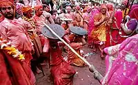 In the Braj region of North India, women have the option to playfully hit men who save themselves with shields; for the day, men are culturally expected to accept whatever women dish out to them. This ritual is called Lath Mar Holi.