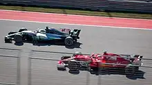 Lewis_Hamilton_and_Sebastian_Vettel_2017_United_States_GP_(38000070491)