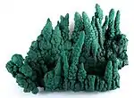 Malachite stalactites (to 9&nbsp;cm height), from Kasompi Mine, Katanga Province, Democratic Republic of the Congo. Size: 21.6×16.0×11.9&nbsp;cm.