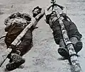Two corpses and a decapitated head belonging to guerrillas killed by the Queen's Own Royal West Kent Regiment.