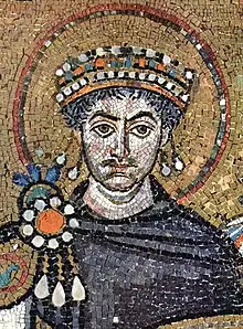 Mosaic of mustachioed, curly-haired man wearing crown and surrounded by halo