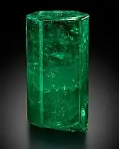Large, di-hexagonal prismatic crystal of 1,390 carats uncut with a  deep green color. It is transparent and features few inclusions in the upper 2/3, and is translucent in the lower part. Housed at the Mim Museum, Beirut, Lebanon.