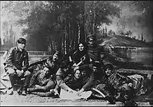 Photograph of insurgent army commanders seated and lying down together