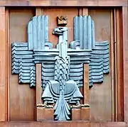 Polish coat of arms (unofficial) on the facade of the post office in Warsaw, Julian Puterman-Sadłowski, architect (1934)
