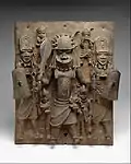 Plaque with warriors and attendants; by artists of the Edo people; 16th-17th century (Nigeria); brass; height: 47.6 cm; Metropolitan Museum of Art