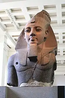 The Younger Memnon (c. 1250 BC), a statue depicting Ramesses II, from the Ramesseum in Thebes. Currently on display at the British Museum in London.