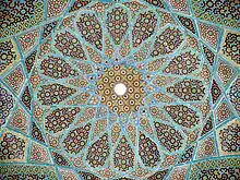 Geometric arabesque tiling on the underside of the dome of Hafiz Shirazi's tomb in Shiraz, Iran