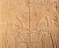 Her-sema-tawy ('Horus, Uniter of the Two Lands'), tying the papyrus and reed plants in the sema tawy symbol for the unification of Upper and Lower Egypt opposite with Set (Sutekh)