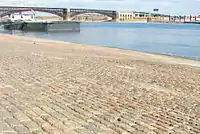 Granite was used for setts on the St. Louis riverfront and for the piers of the Eads Bridge (background)