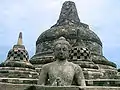 Buddha in the exposed stupa of Borobudur mandala, Central Java, Indonesia, c. 825.