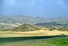 A view of Taif with a road at the foreground and mountains at the background. Muhammad went there to preach Islam.