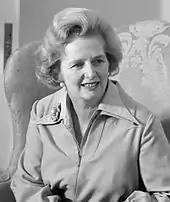 Thatcher sitting in a black-and-white photograph