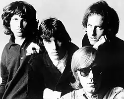 The Doors in 1966: Morrison (left), Densmore (center), Krieger (right) and Manzarek (seated)