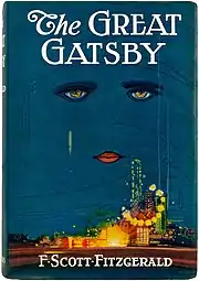 Dust jacket of The Great Gatsby by illustrator Francis Cugat. The book cover has a white-lettered title against a dark blue sky. Beneath the title are lips and two eyes, looming over a carnival-like metropolis.