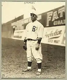 Stengel stands in the outfield, playing his position and wearing sunglasses