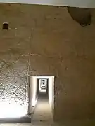 Exit from the burial chamber; on the left, one of the rectangular holes of possible 'air shafts'