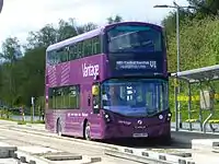 Level-boarding onto a double-decker bus on the Leigh-Salford-Manchester Bus Rapid Transit