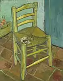 A single, simple, yellow, wooden and straw, armless, empty chair, with a pipe and tobacco on the seat, in an empty room with tiles on the floor.