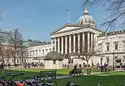 The UCL main building, in stone with a classical portico topped by a large dome