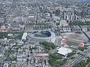 Yankee Stadium (center), Bronx County Courthouse and the Grand Concourse (towards the top), and the site of Yankee Stadium's predecessor to the far right