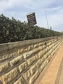 Sign in front of the Wilson Place museum, downtown Menomonie